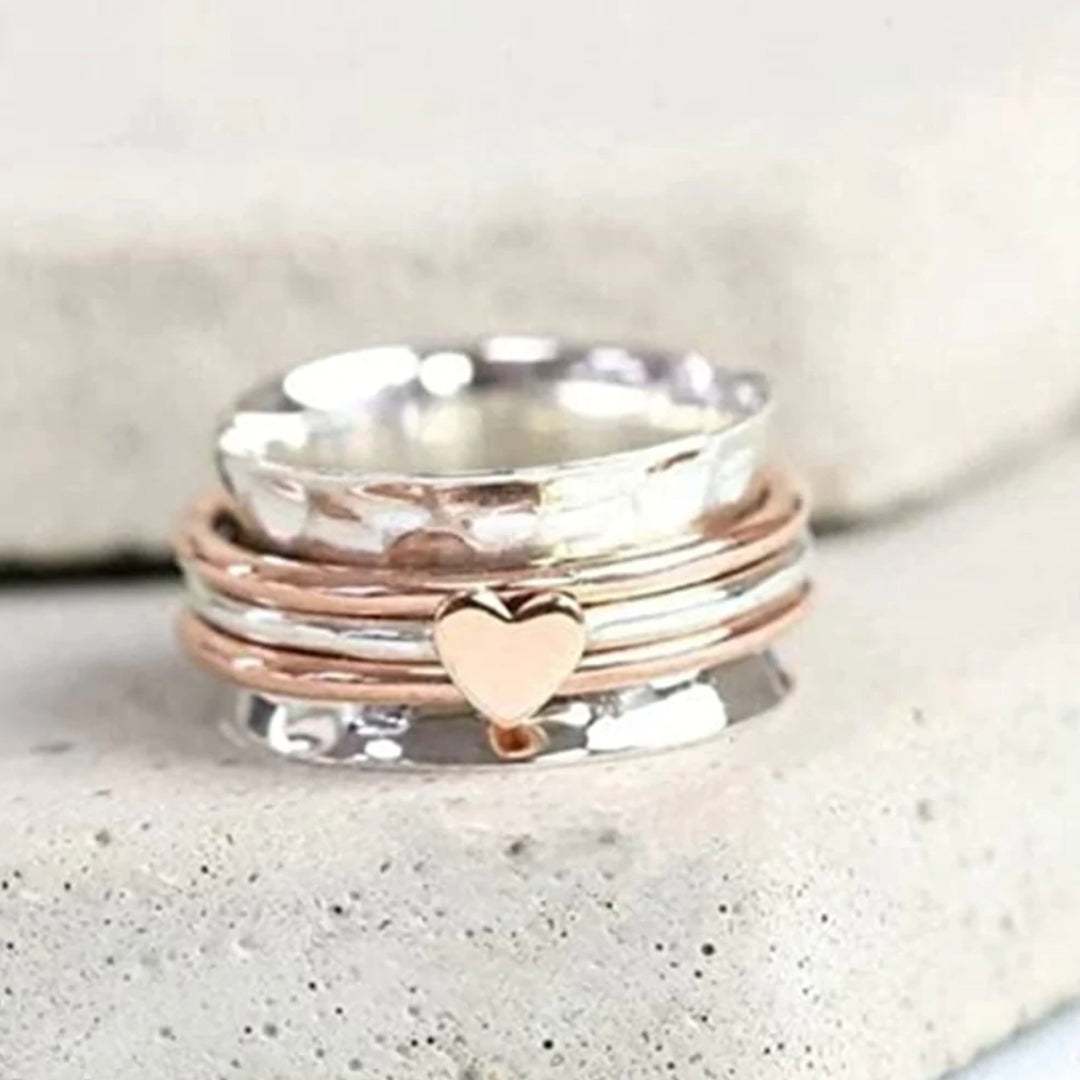 Skanto | Rotating Heart Ring - Amara
