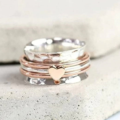 Skanto | Rotating Heart Ring - Amara