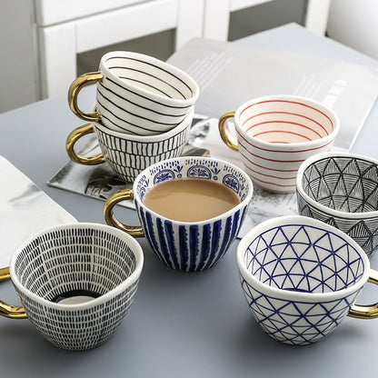 BowLift | Cup with abstract geometric pattern and gold handle