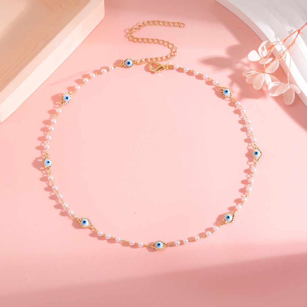 Elegant Pearl and Eye Charm Necklace Acalora