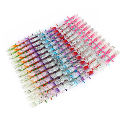 Artificial nails in modern ombre design with marbled accents Acalora
