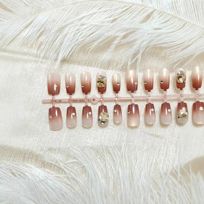 Artificials nails in elegant ombre style with rhinestone embellished applications Acalora
