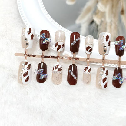 Artificial nails with sparkling rhinestone and bow accents Acalora