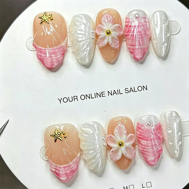Artificial nail set with floral accents and glitter decorations Acalora