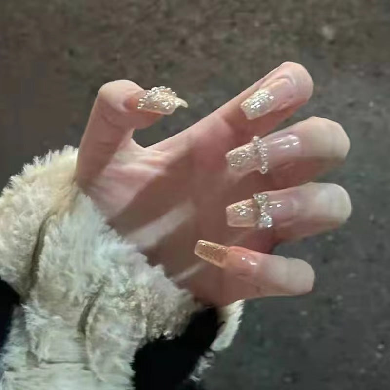 Glamorous artificial nails with sparkling rhinestone and glitter elements Acalora