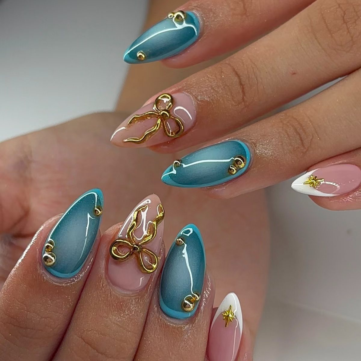 Artistic Stiletto Nail Art Set with Gold Accents Acalora