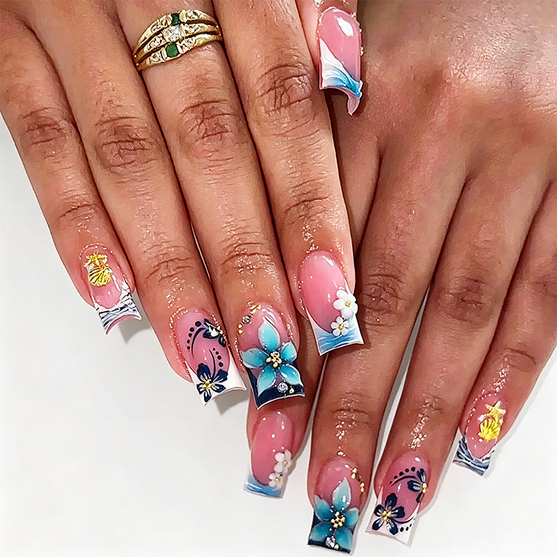 Artificial nails in creative floral design with glitter accents Acalora