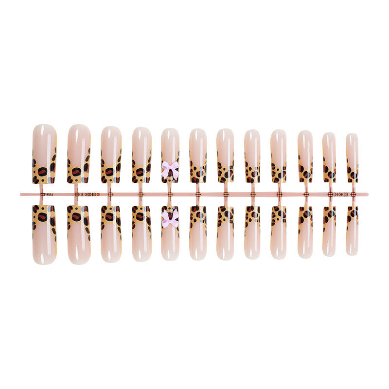 Decorative Stiletto Press-On Nail Art with Animal Print and Bow Accents Acalora