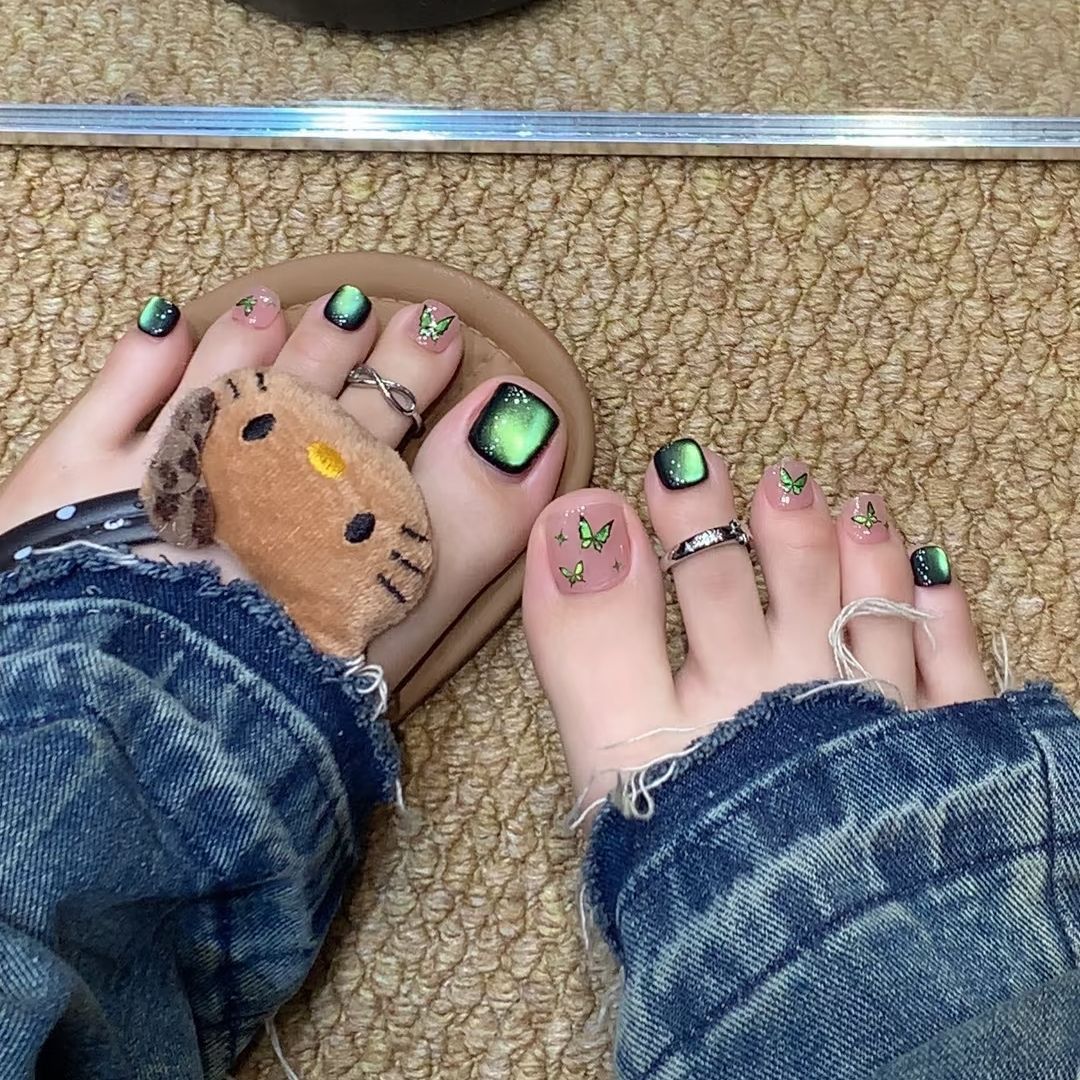 Artistic toenails with detailed butterfly design Acalora