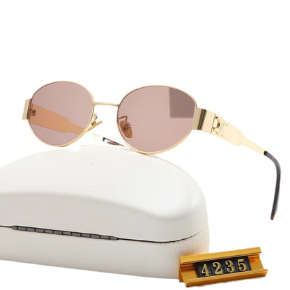 Women's elegant oval sunglasses with gold-colored frame Skanto