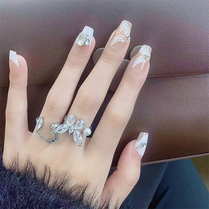Elegant artificial nail set with delicate decorations and glitter elements Acalora