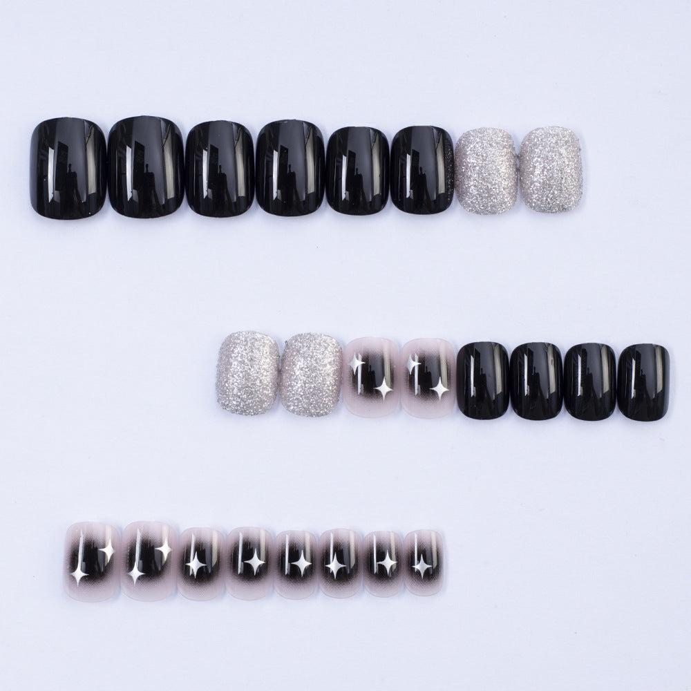 Artificial nails in elegant black with gloss and creative accents Acalora