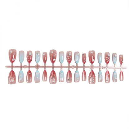 Artificial nails with sparkling rhinestone embellishments and maritime design Acalora