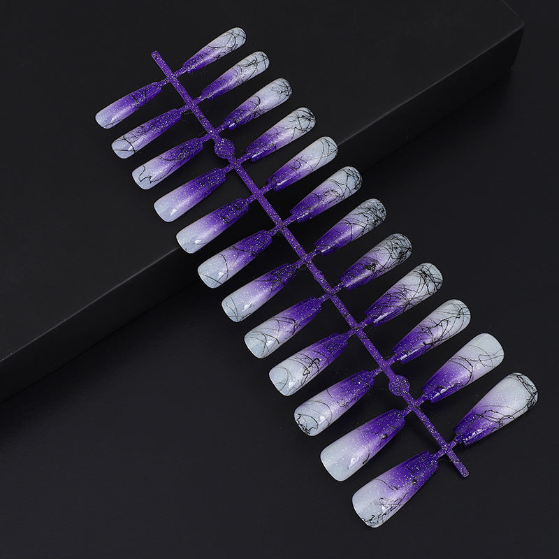 Artificial nails in modern ombre design with marbled accents Acalora