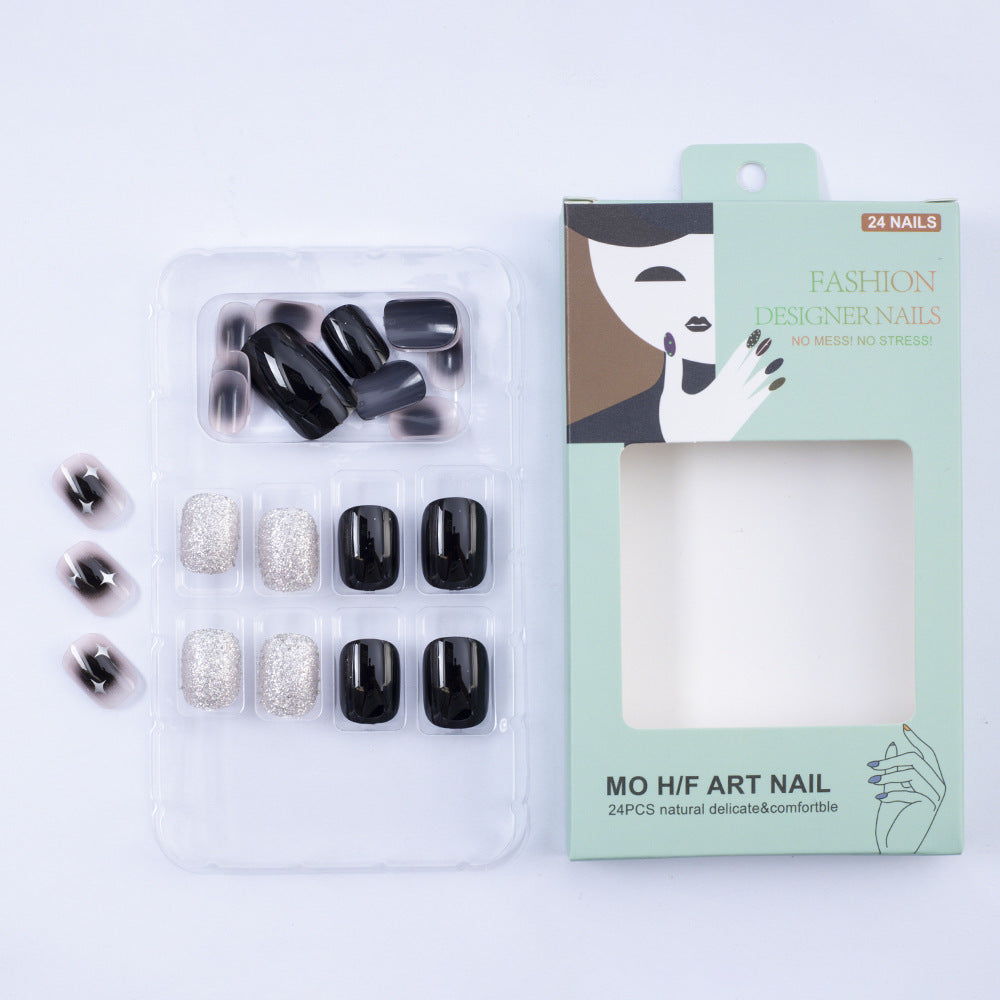 Artificial nails in elegant black with gloss and creative accents Acalora