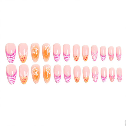 Acrylic nail set with exotic flower patterns and glitter accents Acalora