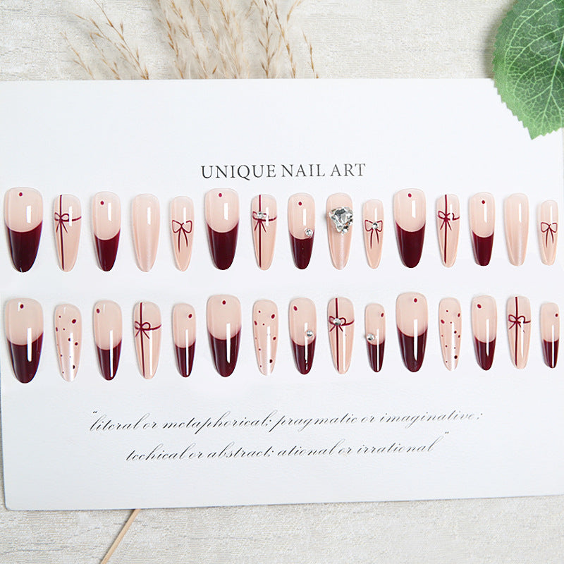 Artificial nail set with elegant bow and glitter details Acalora