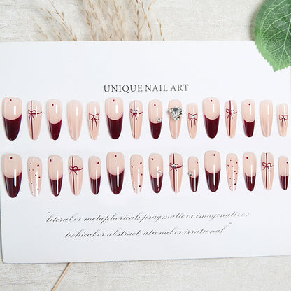 Artificial nail set with elegant bow and glitter details Acalora