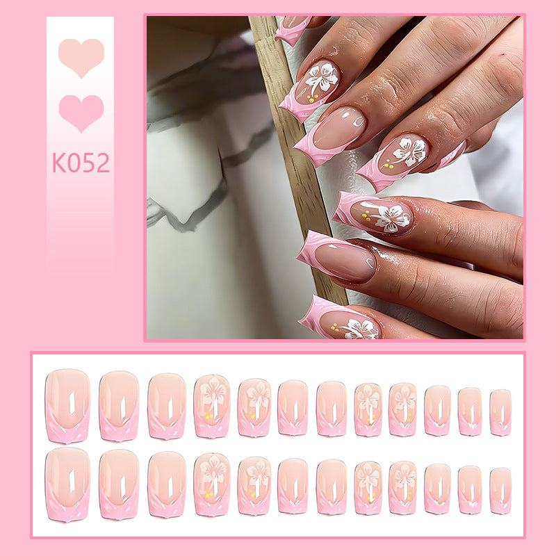 Artificial nail set with floral applications and elegant accents Acalora