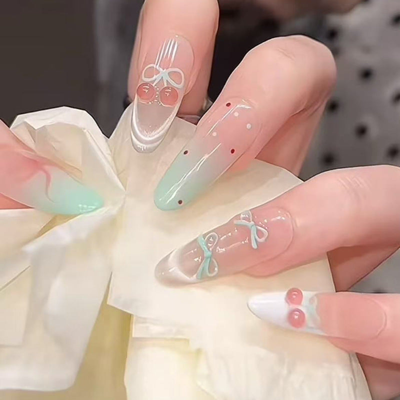 Artificial nail set with elegant bow and cherry designs Acalora