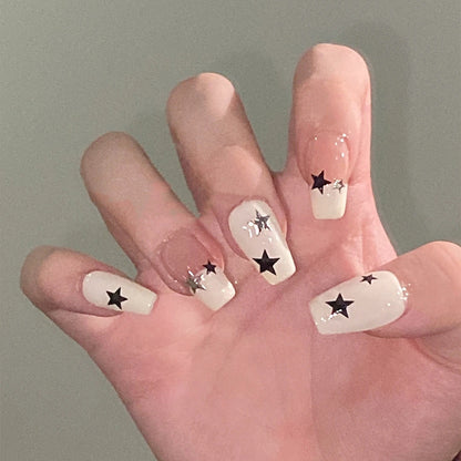 Artificial nail set with glamorous star design and sparkling accents Acalora