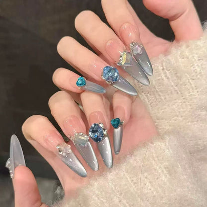 Glamorous artificial nail tips with elegant decorations Acalora