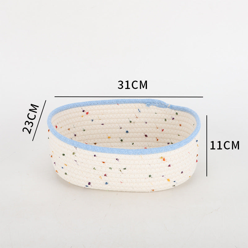 Storage basket made of natural cotton fabric with colorful dots