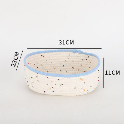 Storage basket made of natural cotton fabric with colorful dots