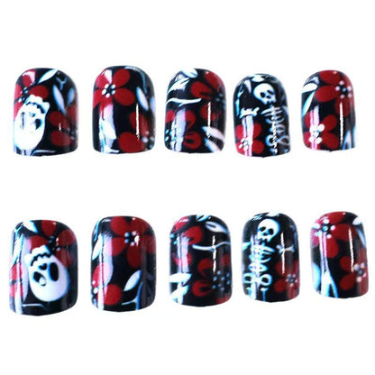 Artificial nail set with creepy skull design and floral accents Acalora