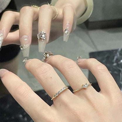 Art nail set with filigree decorations and glamorous accents Acalora