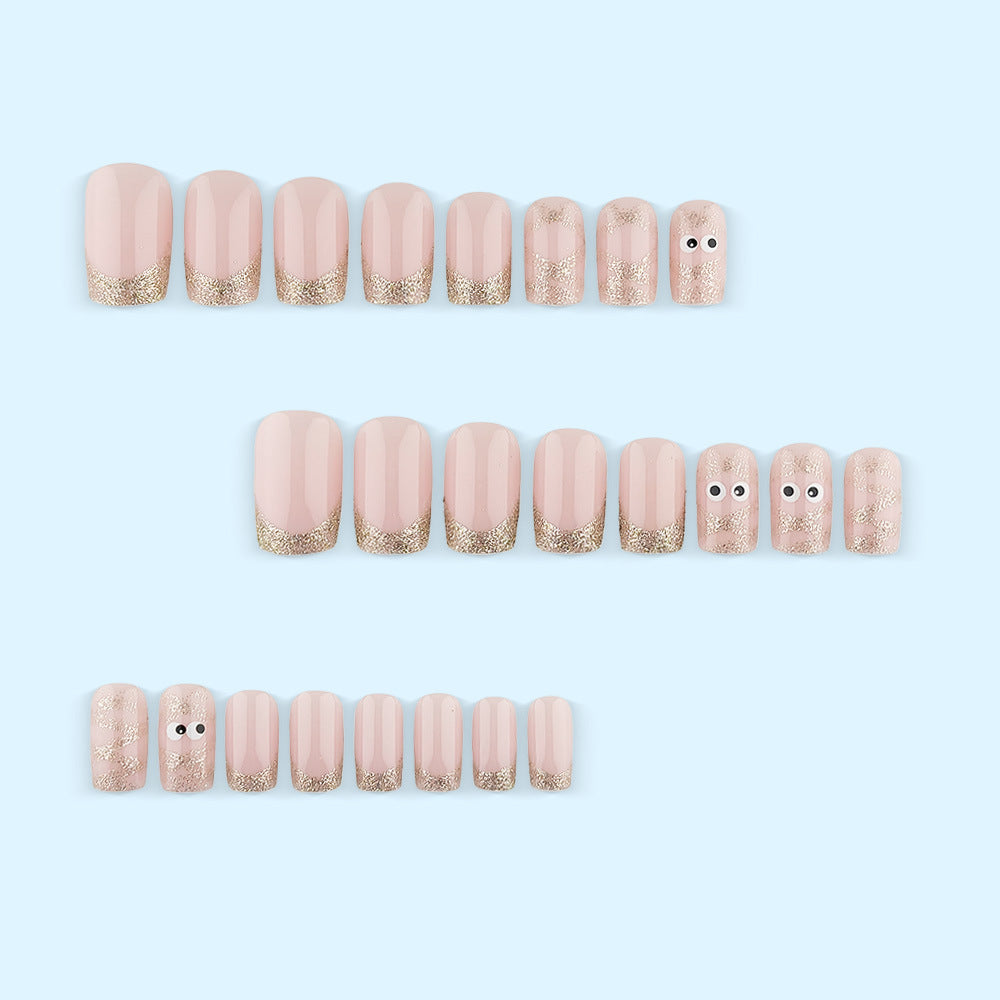 Artificials nails with playful eye design and glitter tips Acalora