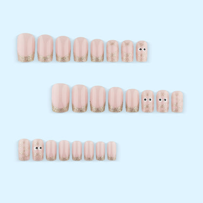 Artificials nails with playful eye design and glitter tips Acalora