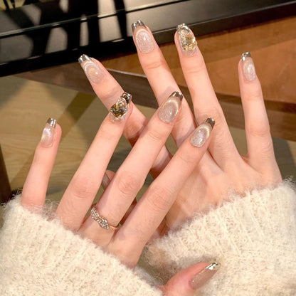 Artificial nail set with glamorous gold and glitter accents Acalora