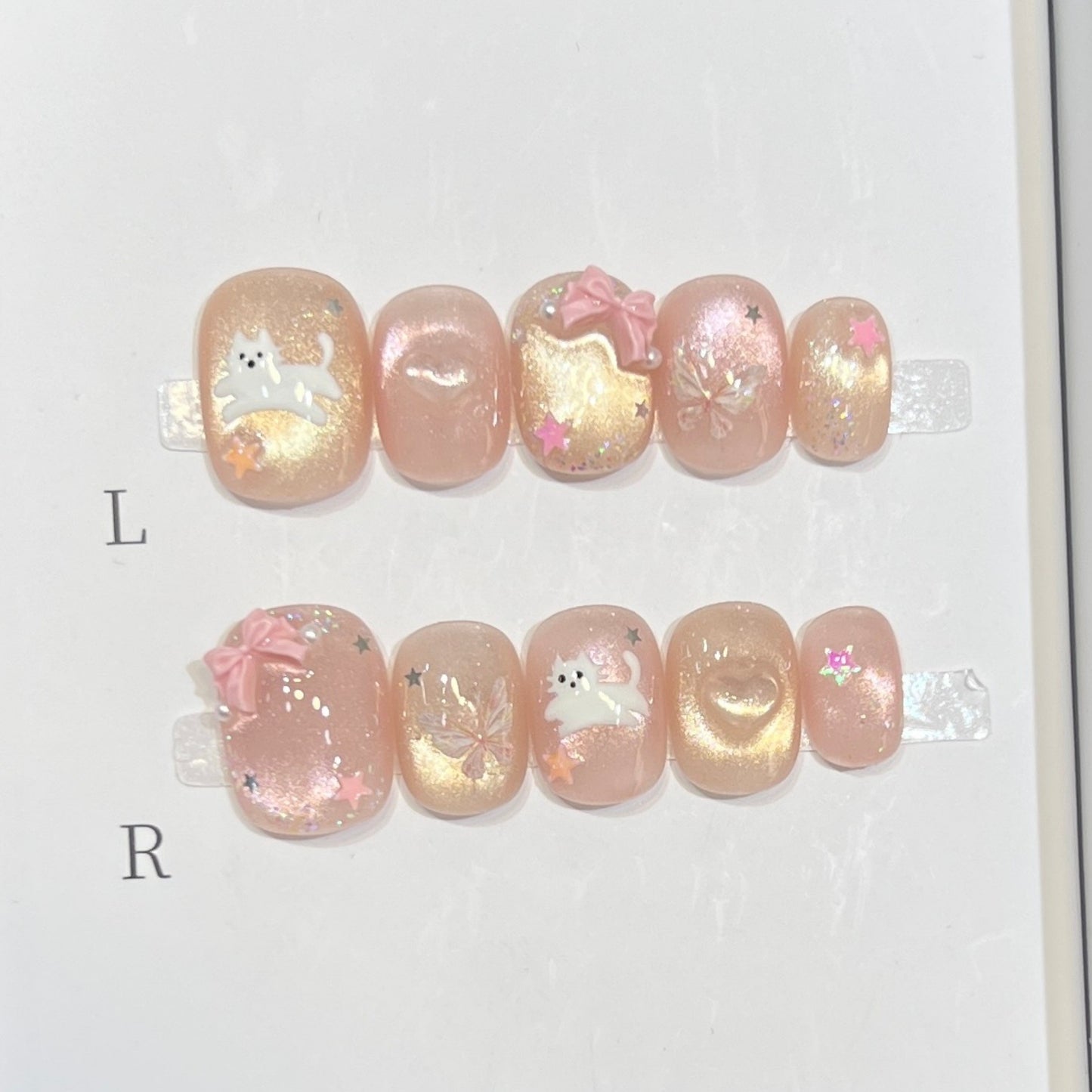 Whimsical Press-On Nail Art Set with Playful Character Designs Acalora