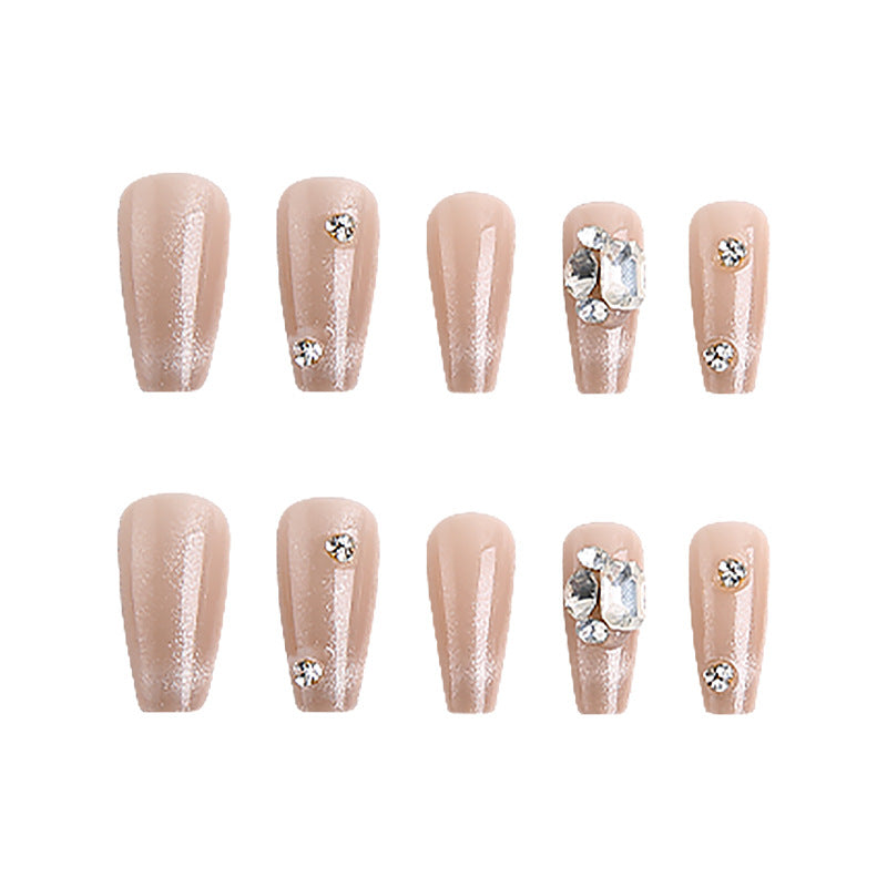 Acrylic nail set with glamorous glitter accents and elegant jewelry embellishments Acalora