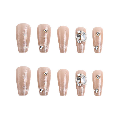 Acrylic nail set with glamorous glitter accents and elegant jewelry embellishments Acalora