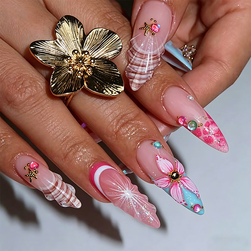 Artificial nail set with glamorous floral designs and creative glitter accents Acalora