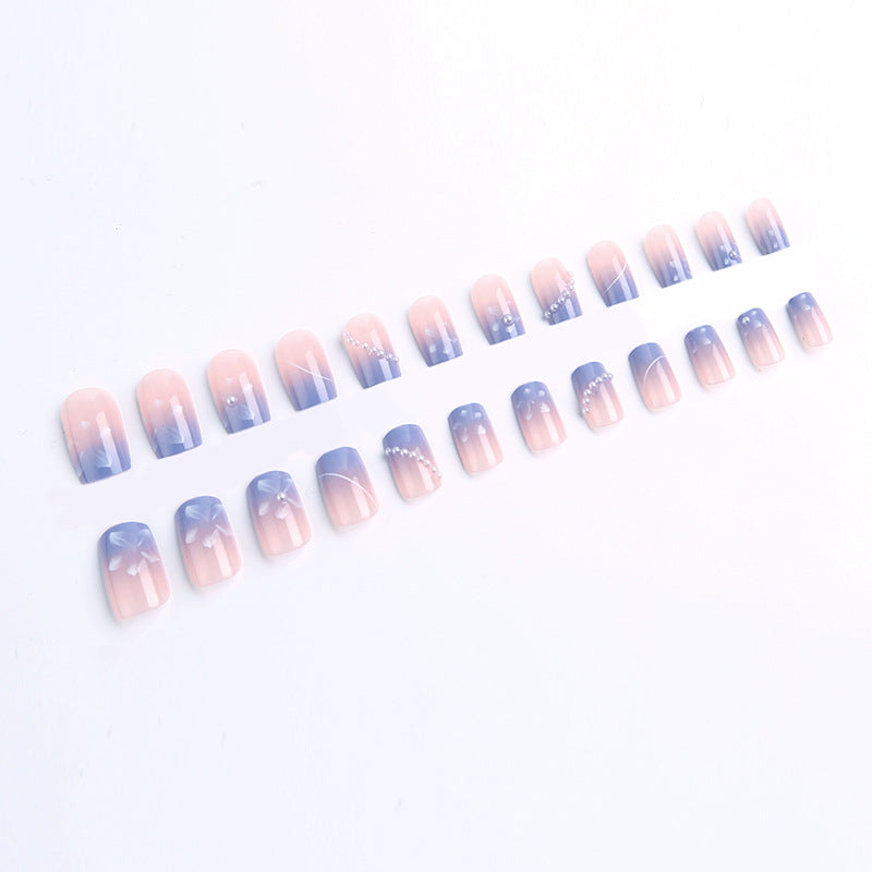 Nail set with elegant floral accents and glitter embellishments Acalora