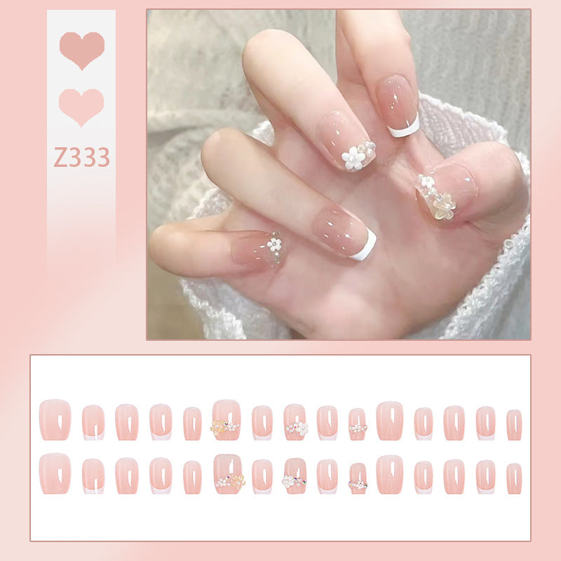 Nail set with elegant flower appliqués and exquisite glitter embellishments Acalora