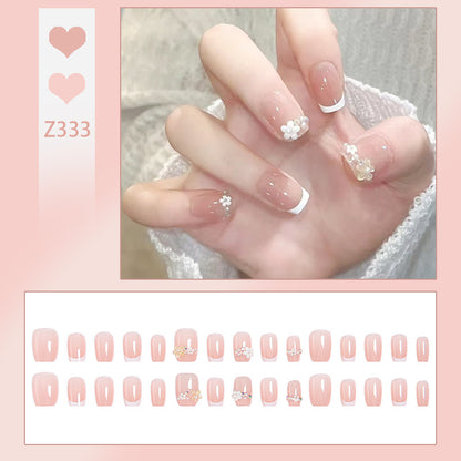Nail set with elegant flower appliqués and exquisite glitter embellishments Acalora