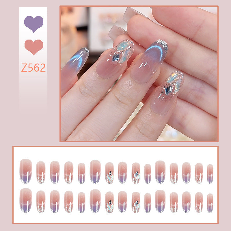 Acrylic nail set with elegant glitter effect and beautified embellishments Acalora