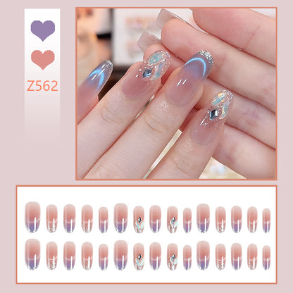 Acrylic nail set with elegant glitter effect and beautified embellishments Acalora