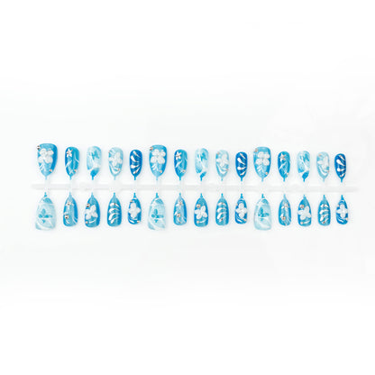 Artificial nail set with floral accents and elegant glitter elements Acalora