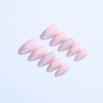 Acrylic nail set with glamorous tips and golden accents Acalora