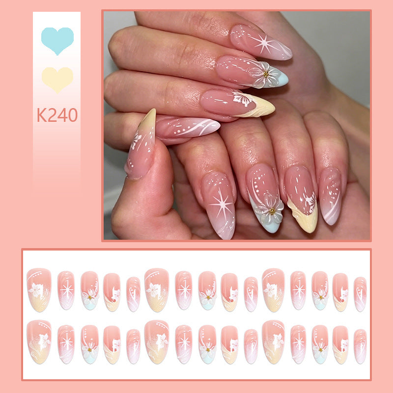Artificial nail set with intricately detailed floral designs and shine accents Acalora