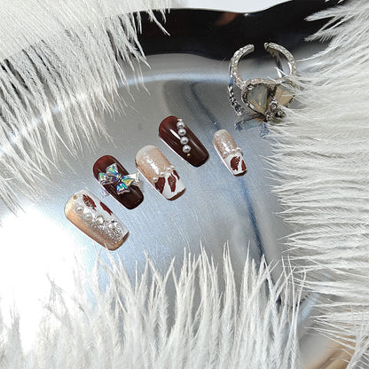 Artificial nails with glamorous 3D applications and glitter Acalora