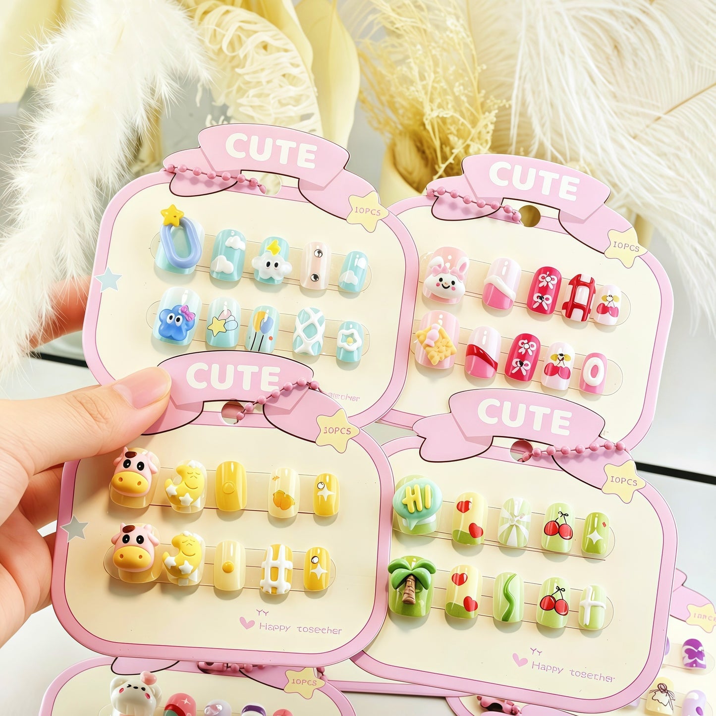 Playful artificial nail set with colorful designs Acalora