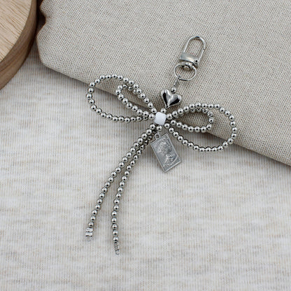 Elegant Beaded Bow Brooch Acalora