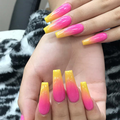 Artificial nail tips in modern ombre design Acalora