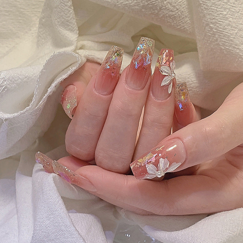 Artificial nail set with floral and glittering accents Acalora